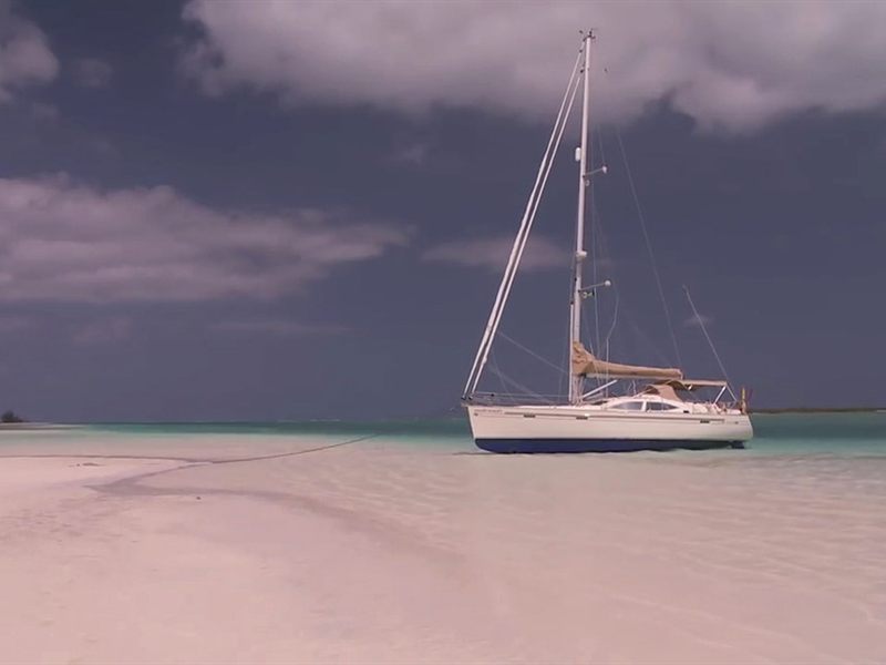 A sailboat anchored off the islands